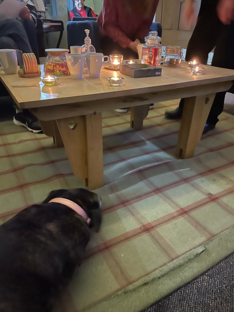 Lighting candles and praying together at a Friday 5pm Recovery Church Service